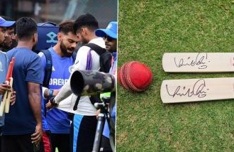 Virat Kohli igives signed bat to young cricketers